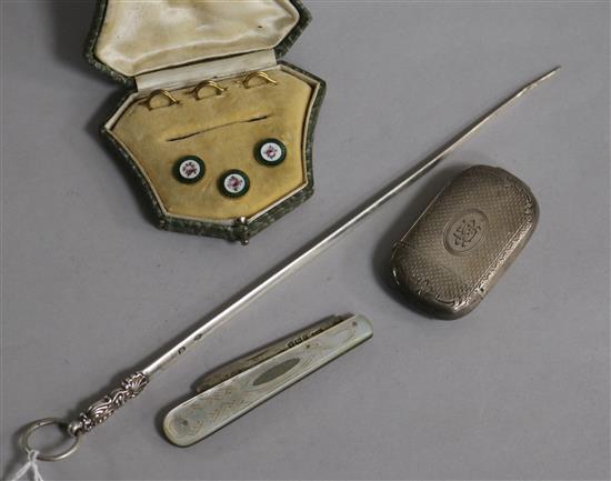 A silver vesta case, a French white metal meat skewer, a silver fruit knife and three cased enamelled studs.